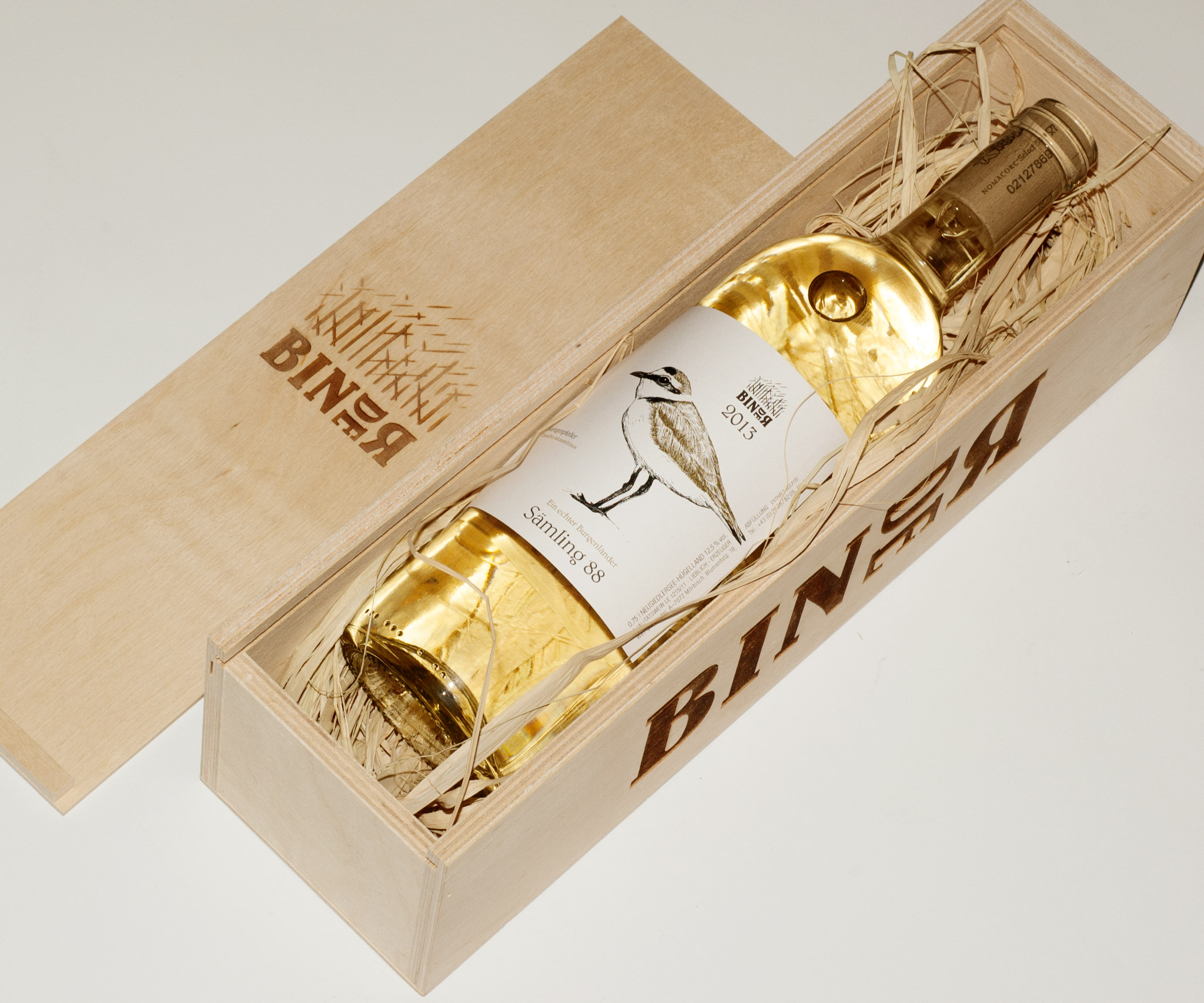 Bottle of Binder whitewine in a wooden box