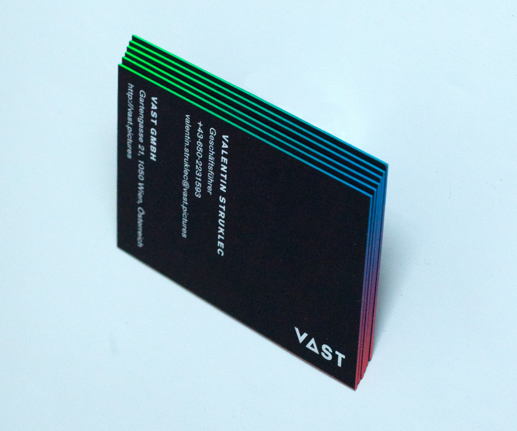 VAST business cards with colored egdes with a gradient