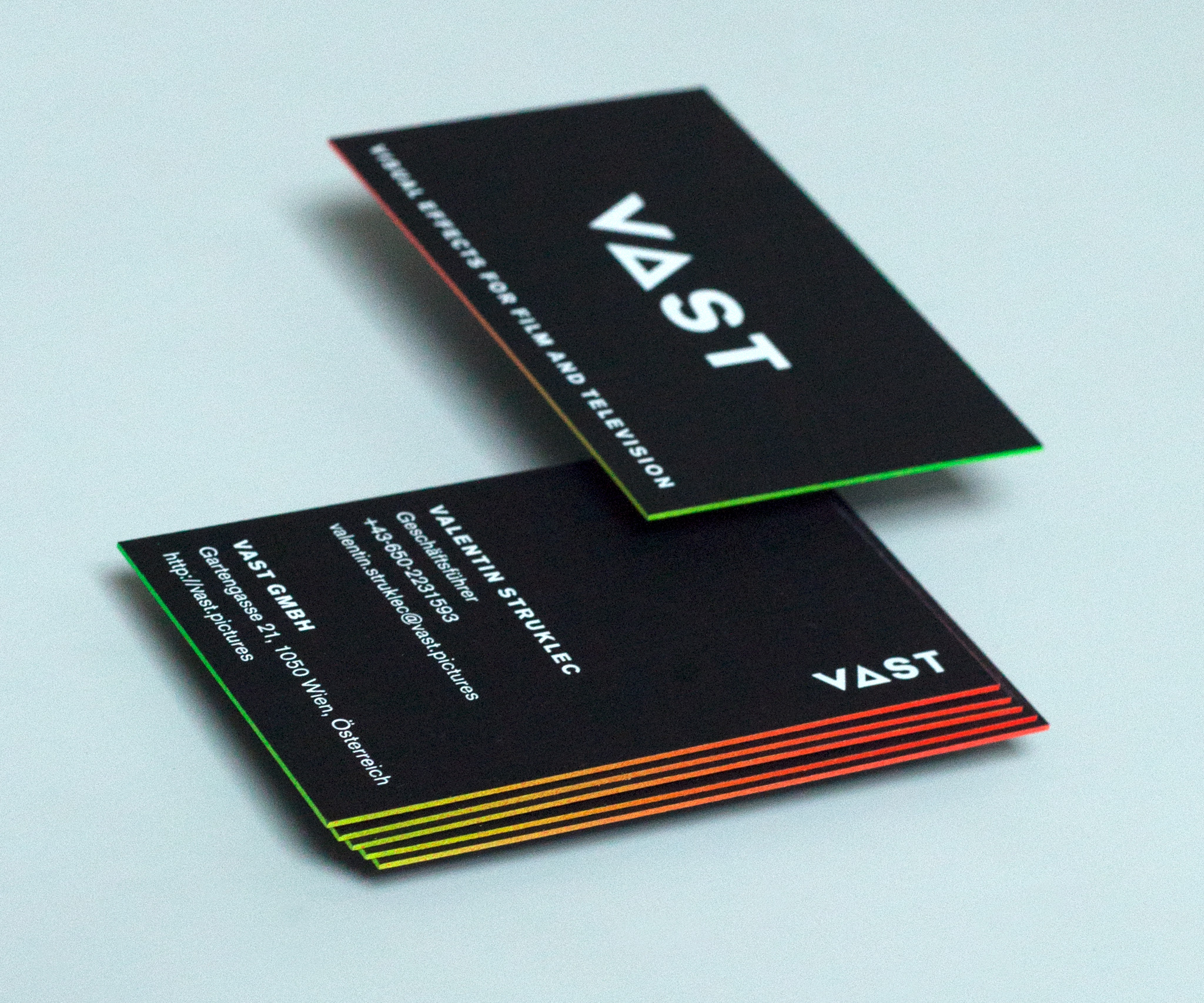 VAST business cards with colored egdes with a gradient