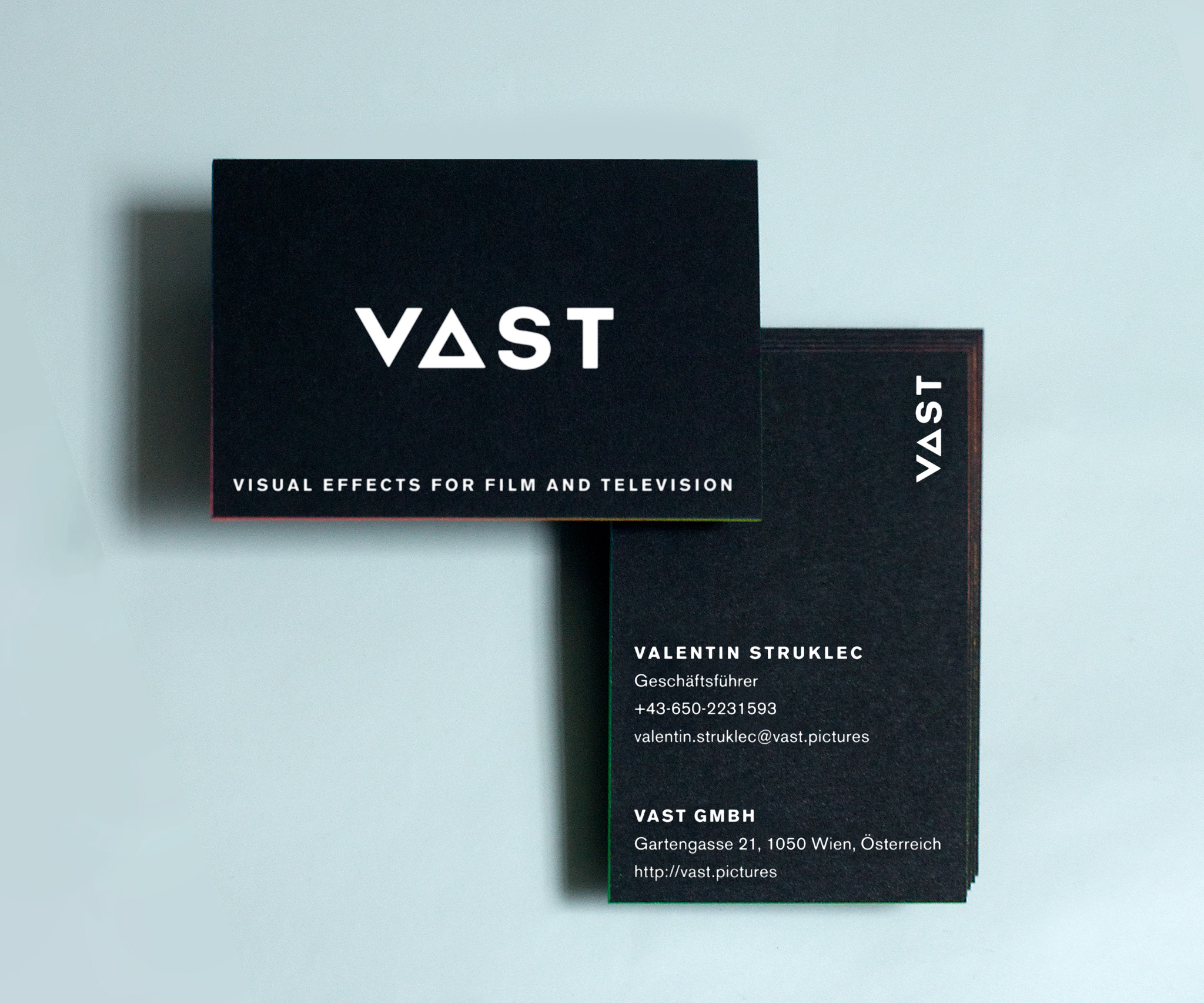 VAST business cards with colored egdes with a gradient VAST business cards
